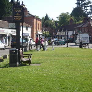 Chalfont st Giles green with boys in cricket whites