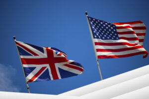 Flags on blue sky background of UK and UK