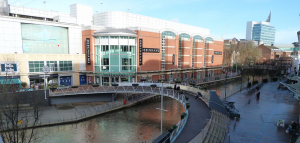Reading town centre with debenhams and stream, bridge and walkway